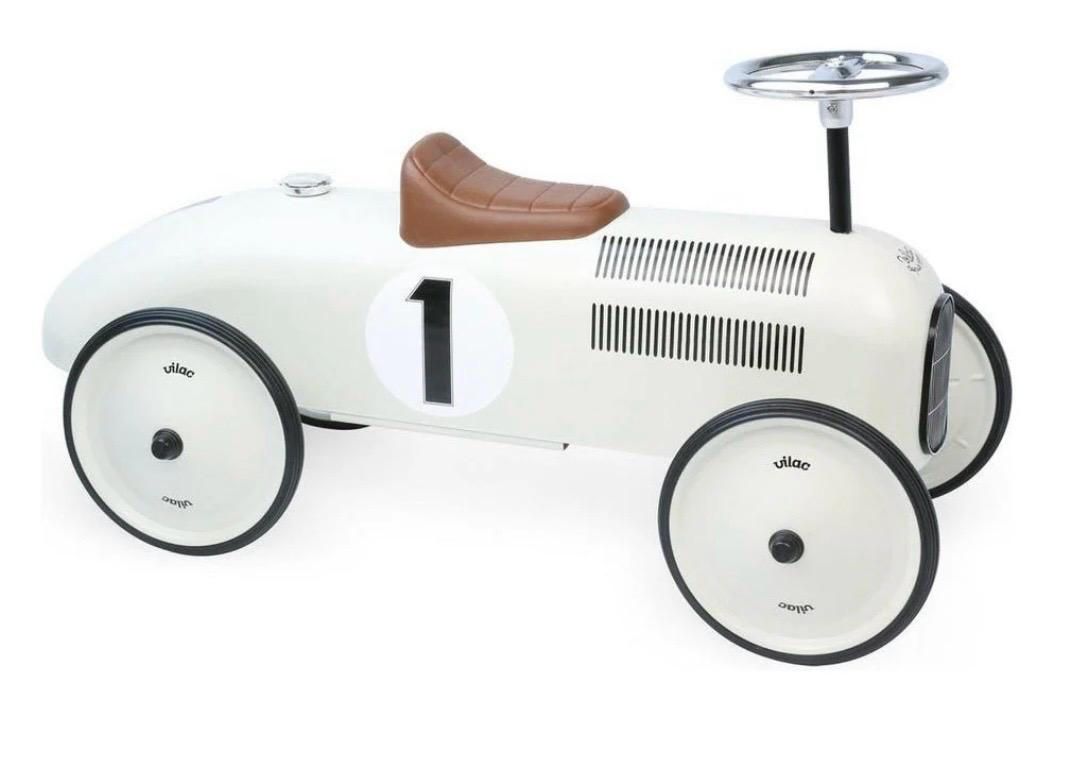 Cream vintage-style ride-on car